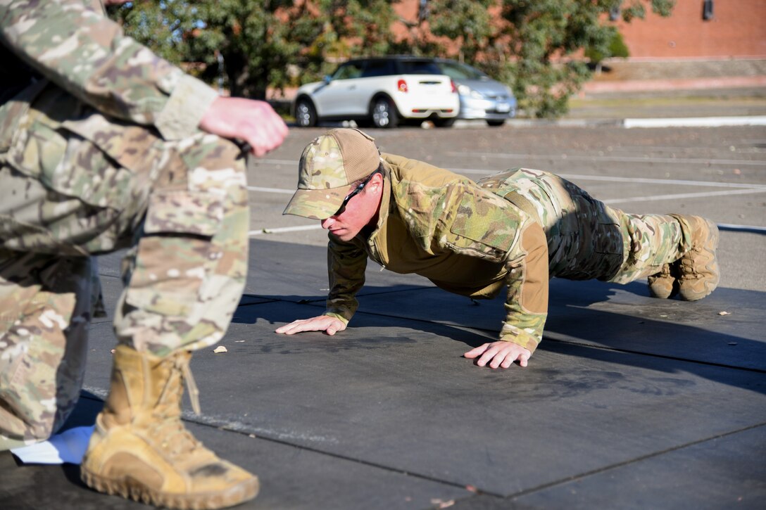 Staff Sgt. Michael Hosfield, 30th Civil Engineer Squadron explosive ordinance disposal specialists, participates in the West Coast Warriors First Responders Appreciation Week on Oct. 15, 2021 to at Vandenberg Space Force Base, Calif. Airman and Guardian compete in the push-up event to demonstrate physical strength and endurance. (U.S. Space Force photo by Airman 1st Class Rocio Romo)