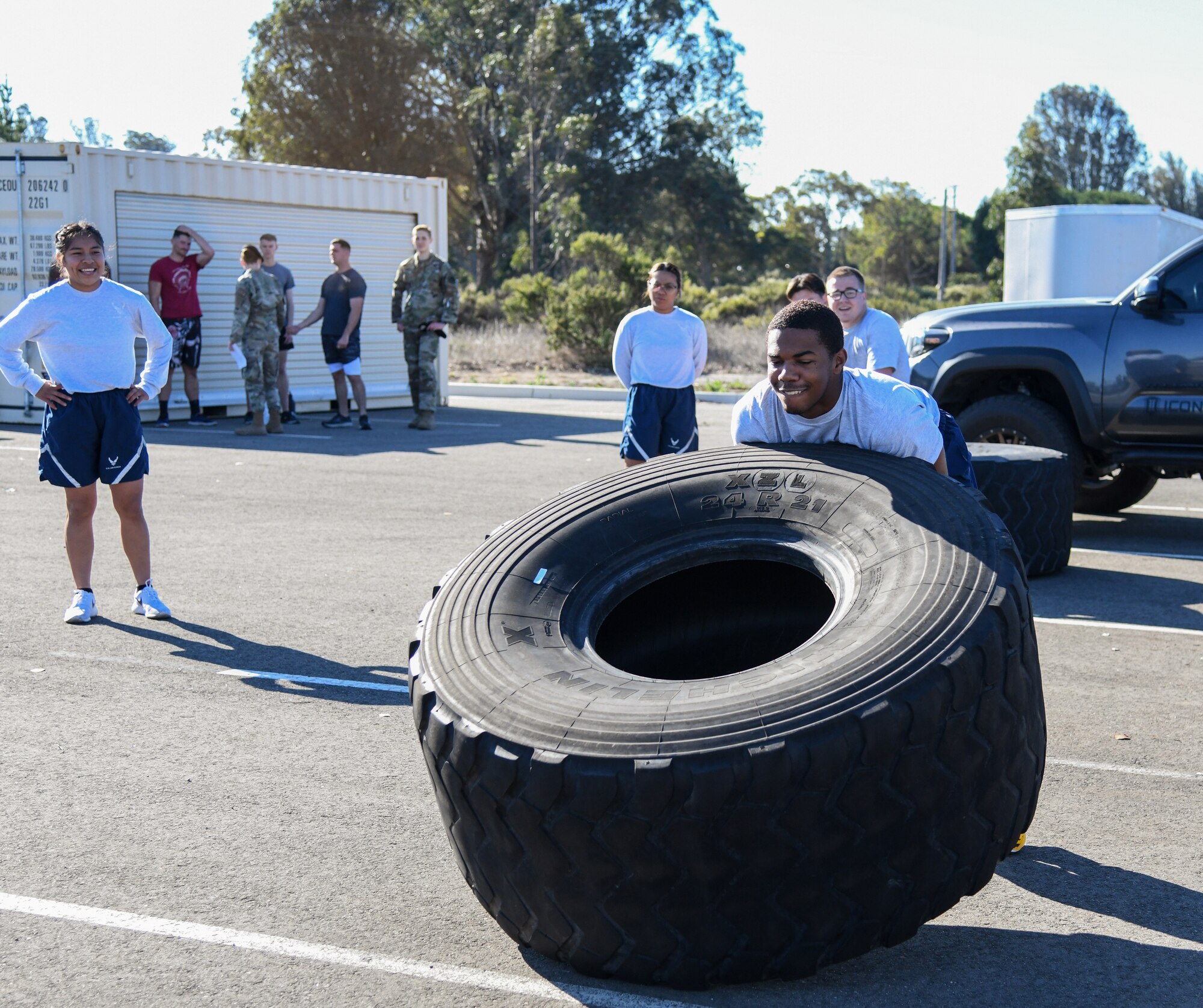 Space Launch Delta 30 Airmen and Guardians compete in the tire flip event to demonstrate physical strength and endurance at the West Coast Warriors First Responders Appreciation Week on Oct. 15, 2021 to at Vandenberg Space Force Base, Calif. (U.S. Space Force photo by Airman 1st Class Rocio Romo)
