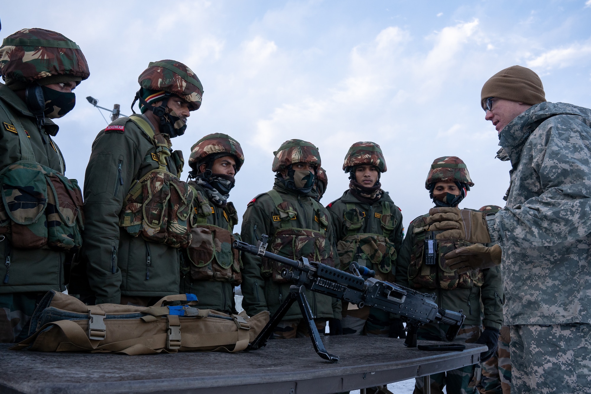 U.S. Army paratroopers with the 4th Infantry Brigade Combat Team (Airborne), 25th Infantry Division, “Spartan Brigade,” and Indian Army troops from 7th Battalion, The Madras Regiment, “Shandaar Saath,” familiarize each other with their respective weapons systems during exercise Yudh Abhyas 21.