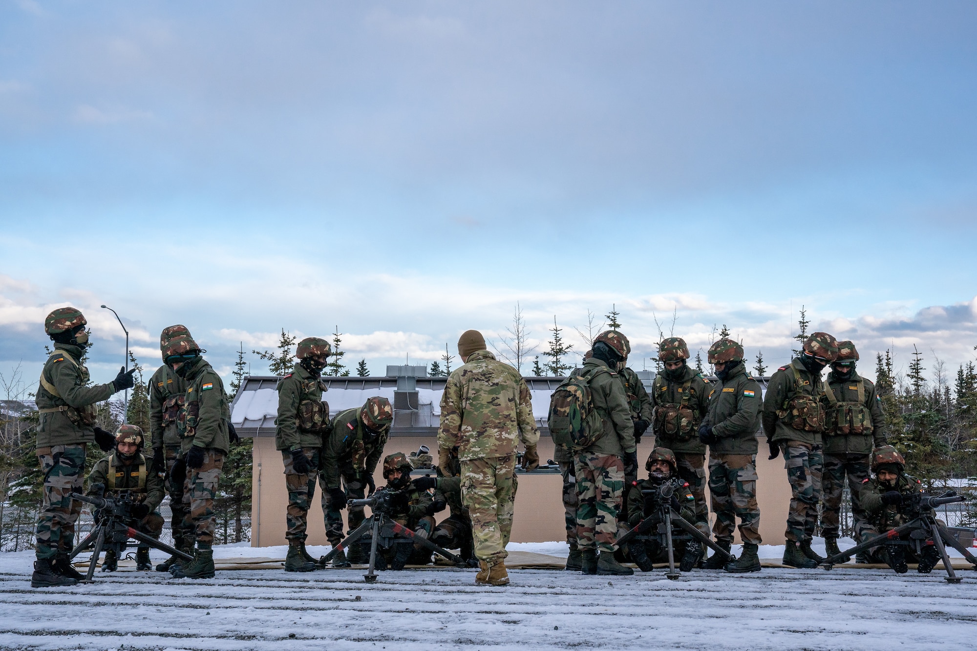 U.S. Army paratroopers with the 4th Infantry Brigade Combat Team (Airborne), 25th Infantry Division, “Spartan Brigade,” and Indian Army troops from 7th Battalion, The Madras Regiment, “Shandaar Saath,” familiarize each other with their respective weapons systems during exercise Yudh Abhyas 21.