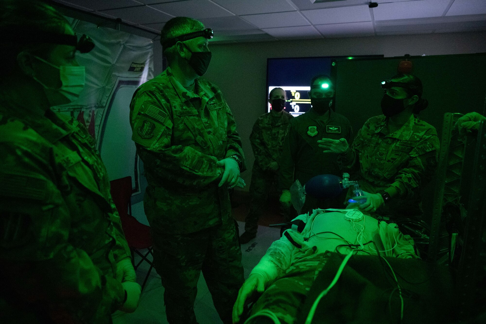 Airmen training in an aeromedical evacuation simulator room