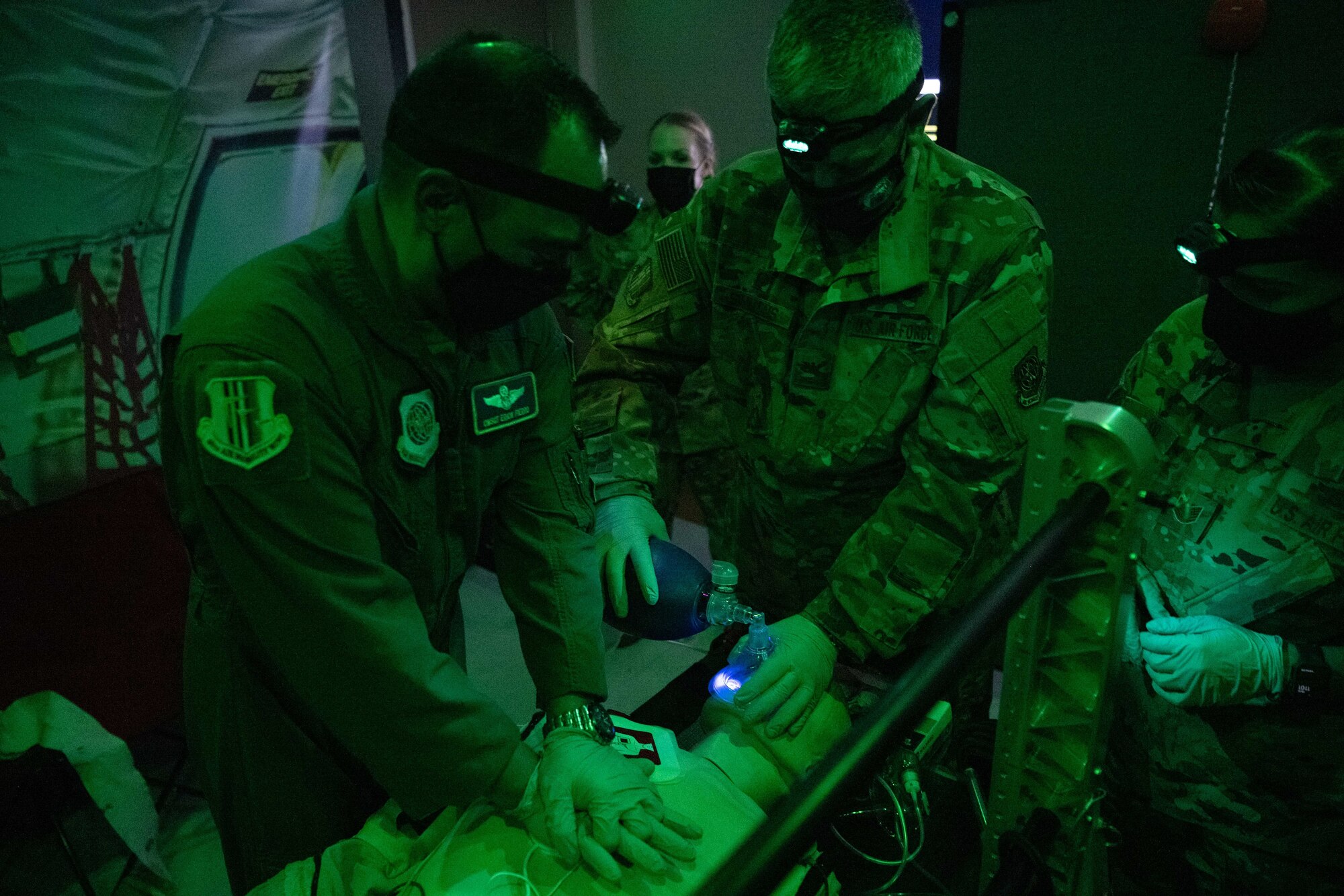 Airmen training in an aeromedical evacuation simulator room