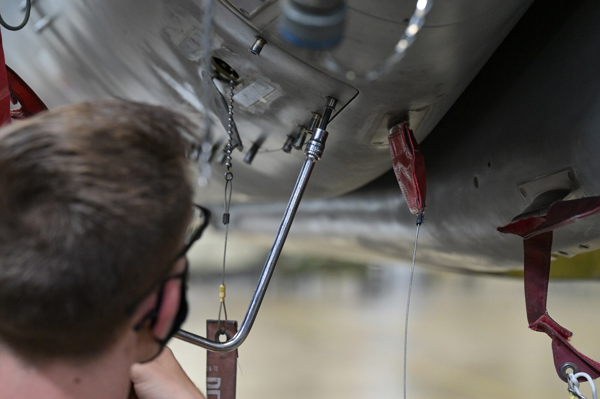 Senior Airman Dakota Johnston, 2nd Munitions Squadron weapons maintenance team member, conducts maintenance on an Air-launched Cruise Missile at Barksdale Air Force Base, Louisiana, Oct. 20, 2021. The ALCM was developed to increase the effectiveness and survivability of the B-52H Stratofortress strategic bomber. (U.S. Air Force photo by Airman 1st Class Jonathan E. Ramos)