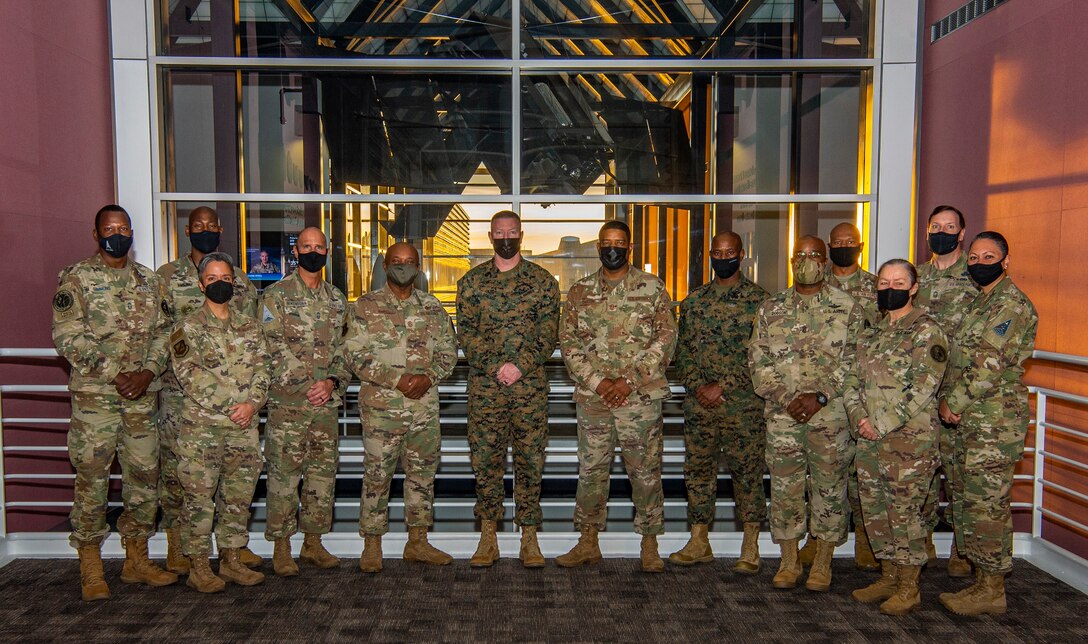 U.S. military senior enlisted leaders pose for a photo at U.S. Space Command headquarters.