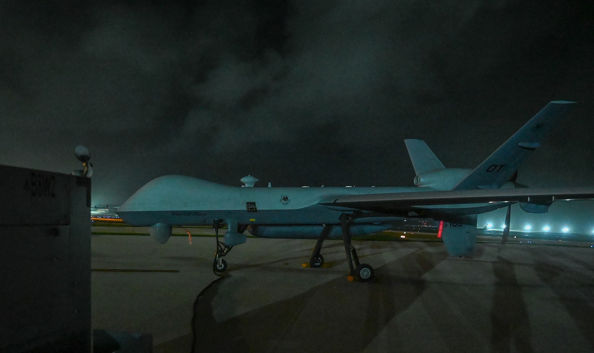 Airmen from the 556th Test and Evaluation Squadron preflight a MQ-9 Reaper at Andersen Air Force Base, Guam, Oct. 4, 2021.
