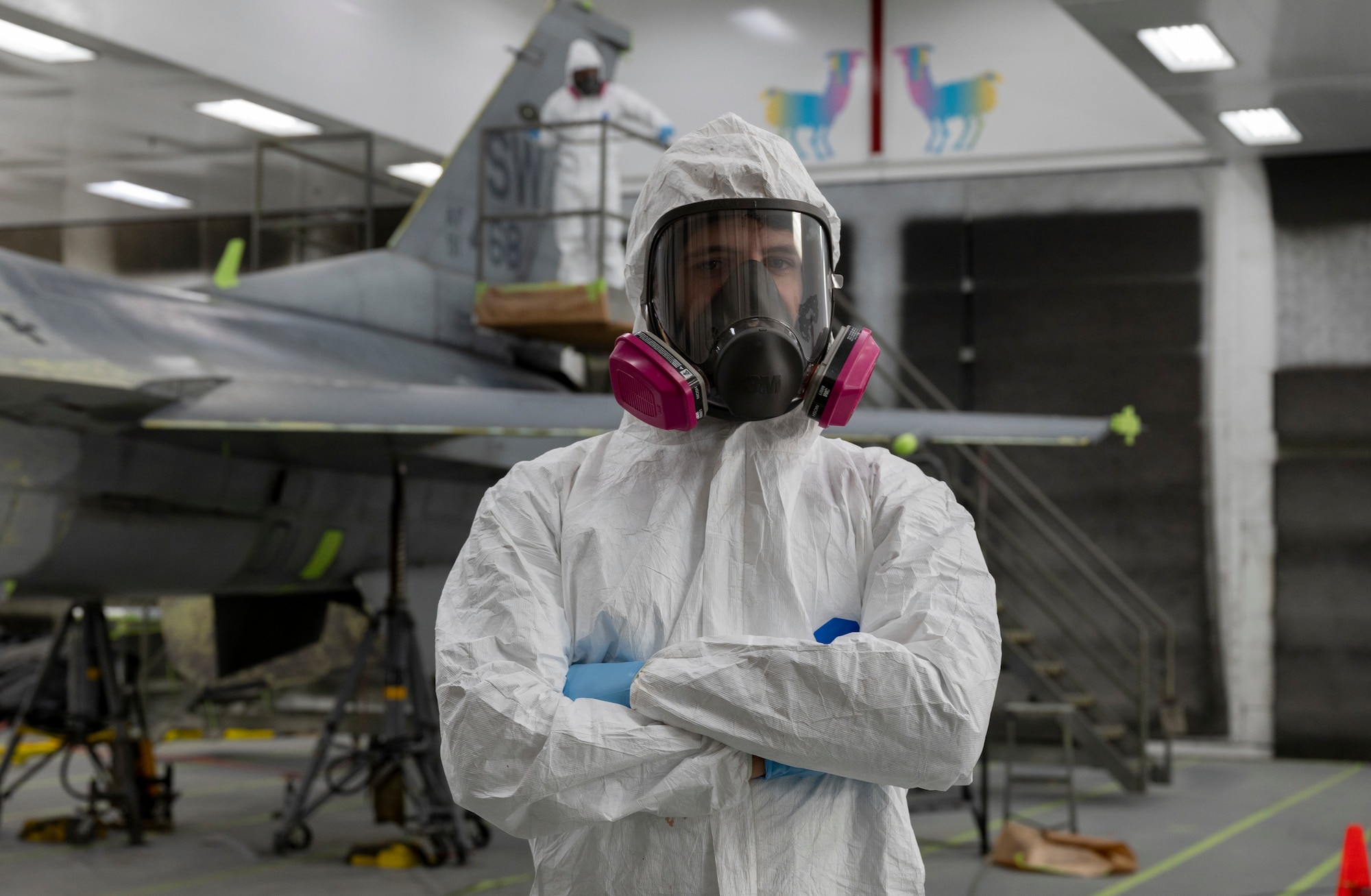 A1C Dylan Varner stands in front of a jet.