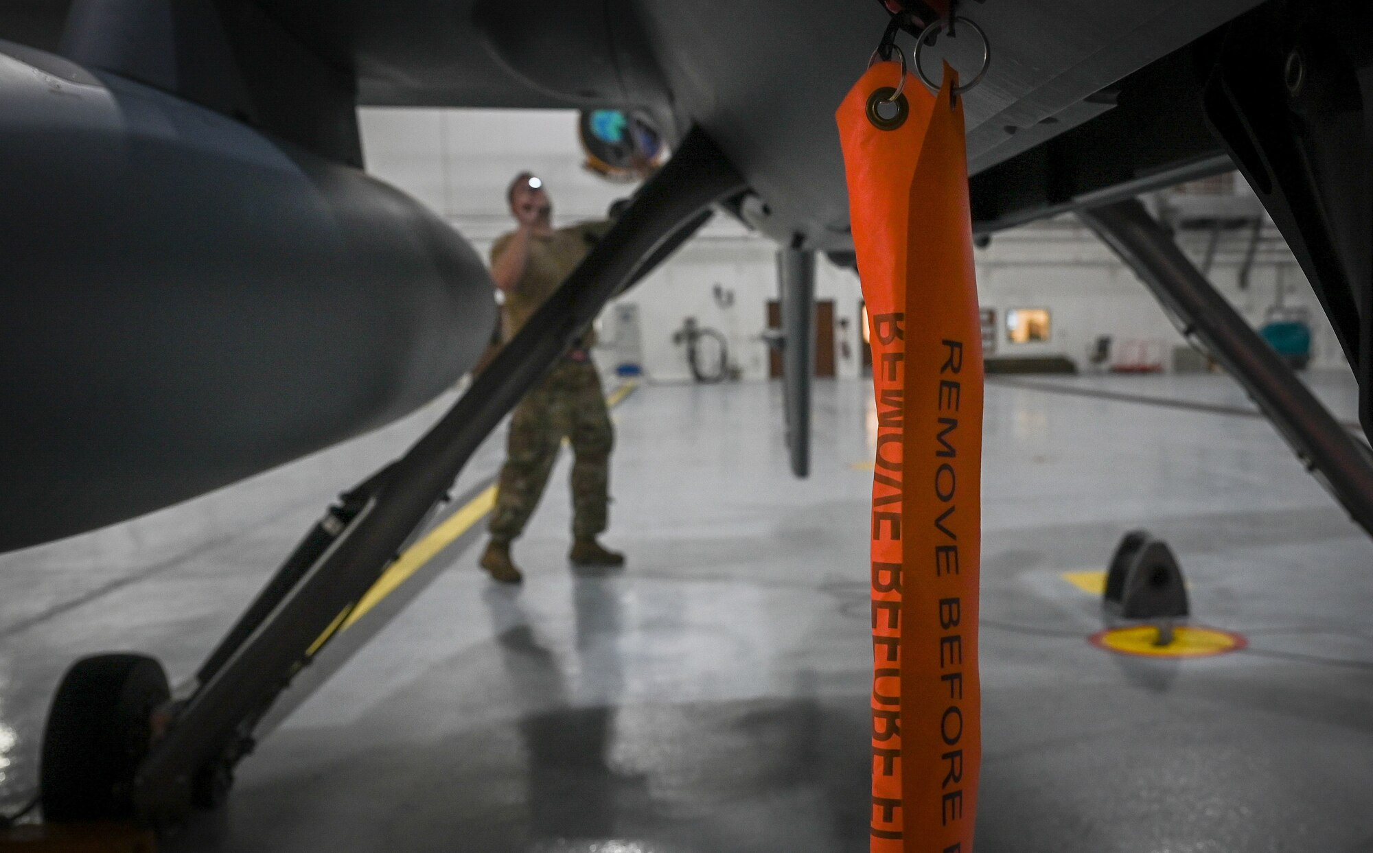 Airmen from the 556th Test and Evaluation Squadron preflight a MQ-9 Reaper at Andersen Air Force Base, Guam, Oct. 4, 2021.
