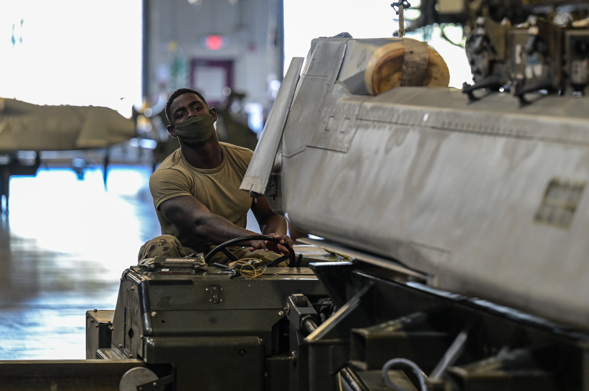 Senior Airman Sterling Brooks, 2nd Munitions Squadron weapons maintenance team member, moves an Air-launched Cruise Missile at Barksdale Air Force Base, Louisiana, Oct. 20, 2021. The ALCM was developed to increase the effectiveness and survivability of the B-52H Stratofortress strategic bomber. (U.S. Air Force photo by Airman 1st Class Jonathan E. Ramos)