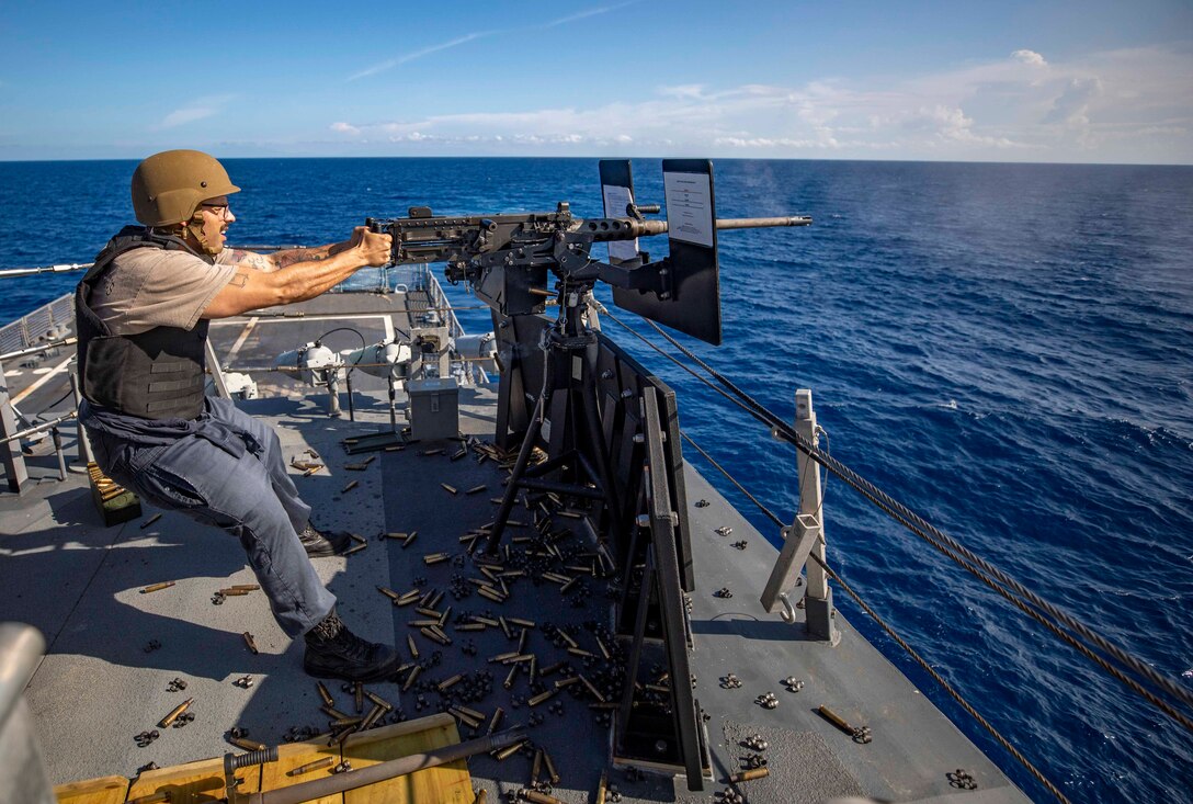 Gunner’s Mate 2nd Class Manuel Iduate fires a .50-caliber machine gun during a live-fire exercise aboard the Freedom-variant littoral combat ship USS Billings (LCS 15).