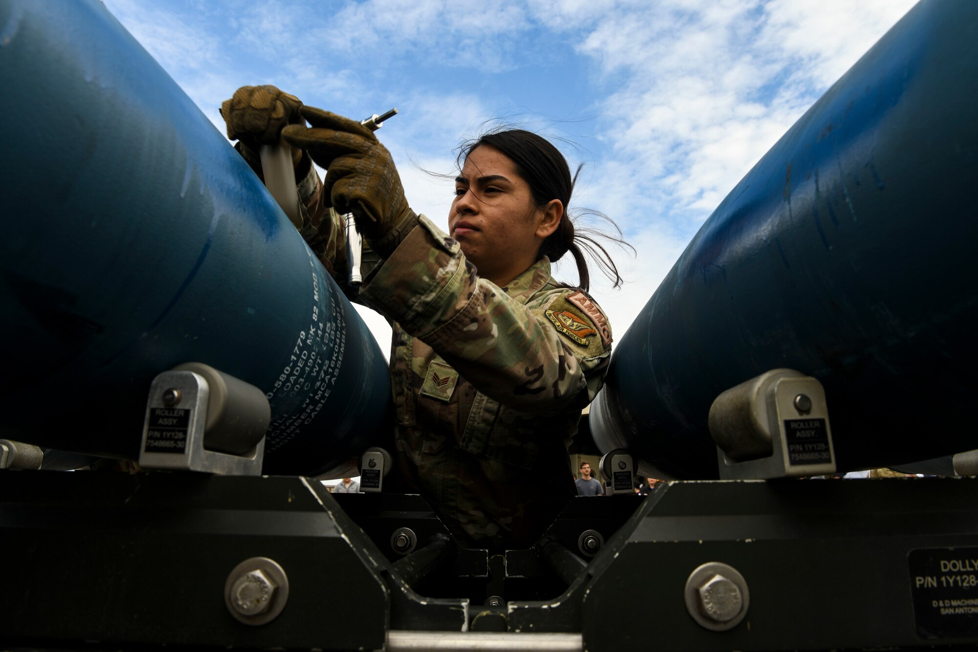 Senior Airman Rosa Valencia, 8th Maintenance Squadron munitions technician, builds a GBU-38 bomb during the Third Quarter Load Crew Competition at Kunsan Air Base, Republic of Korea, Oct. 16, 2021. Munitions technicians had the opportunity to compete against each other in a bomb building competition. (U.S. Air Force photo by Staff Sgt. Jesenia Landaverde)