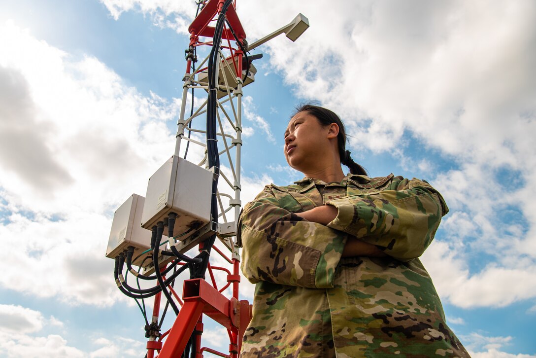 Tech. Sgt. Isabelle Qi, 51st Operations Support Squadron airfield services element non-commissioned officer-in-charge, glances across the airfield at Osan Air Base, Republic of Korea, Oct. 13, 2021.