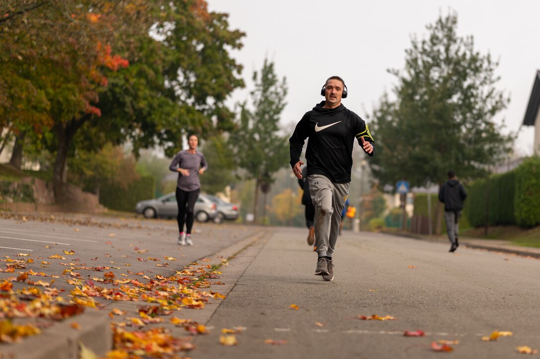Runners on a paved street.