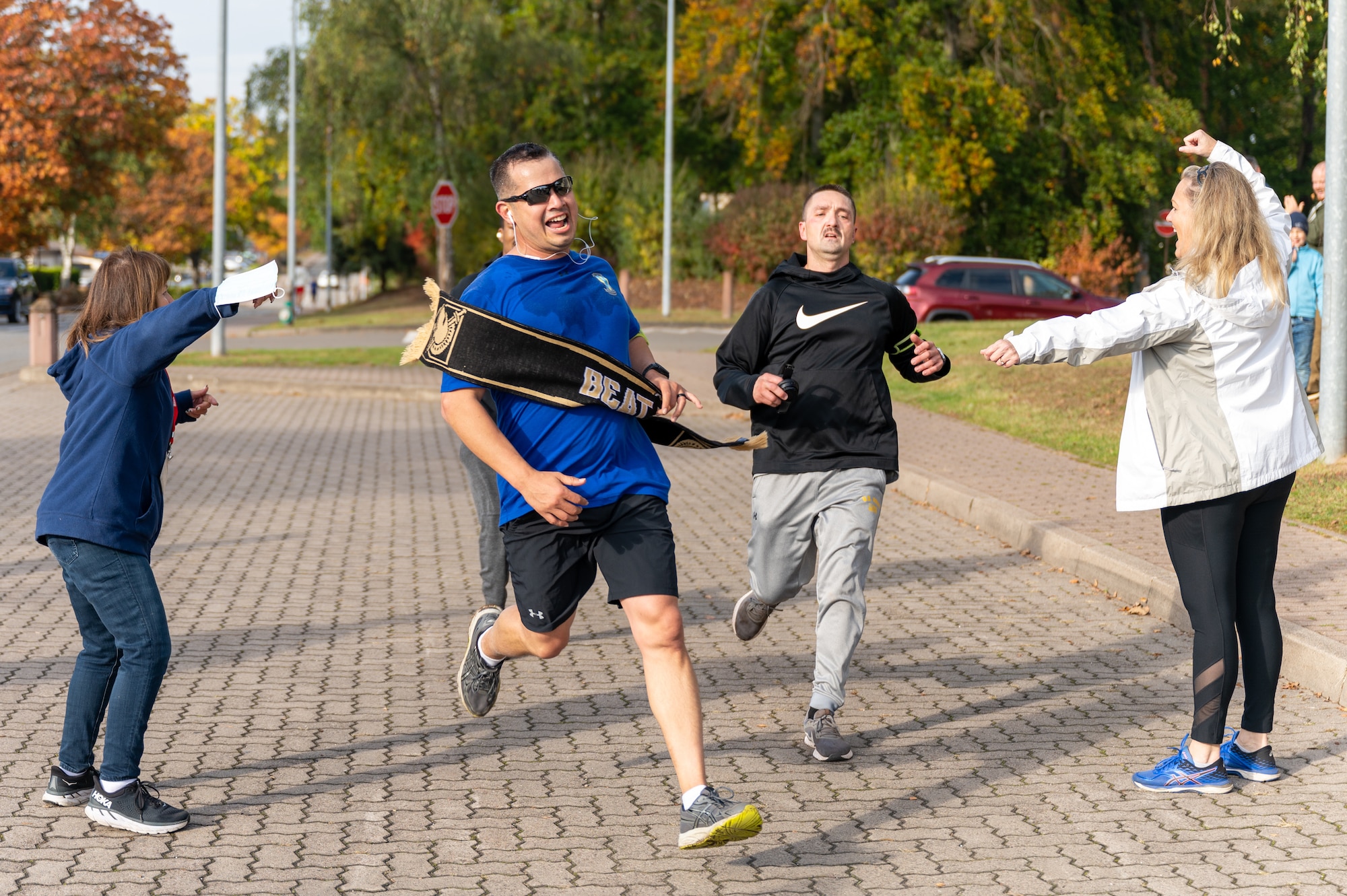 Runners crossing a finish line.