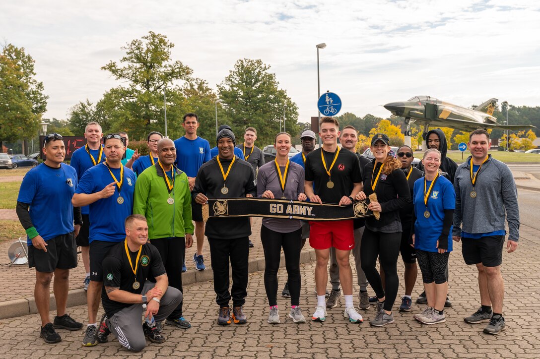 A group of runners posing for a photo.