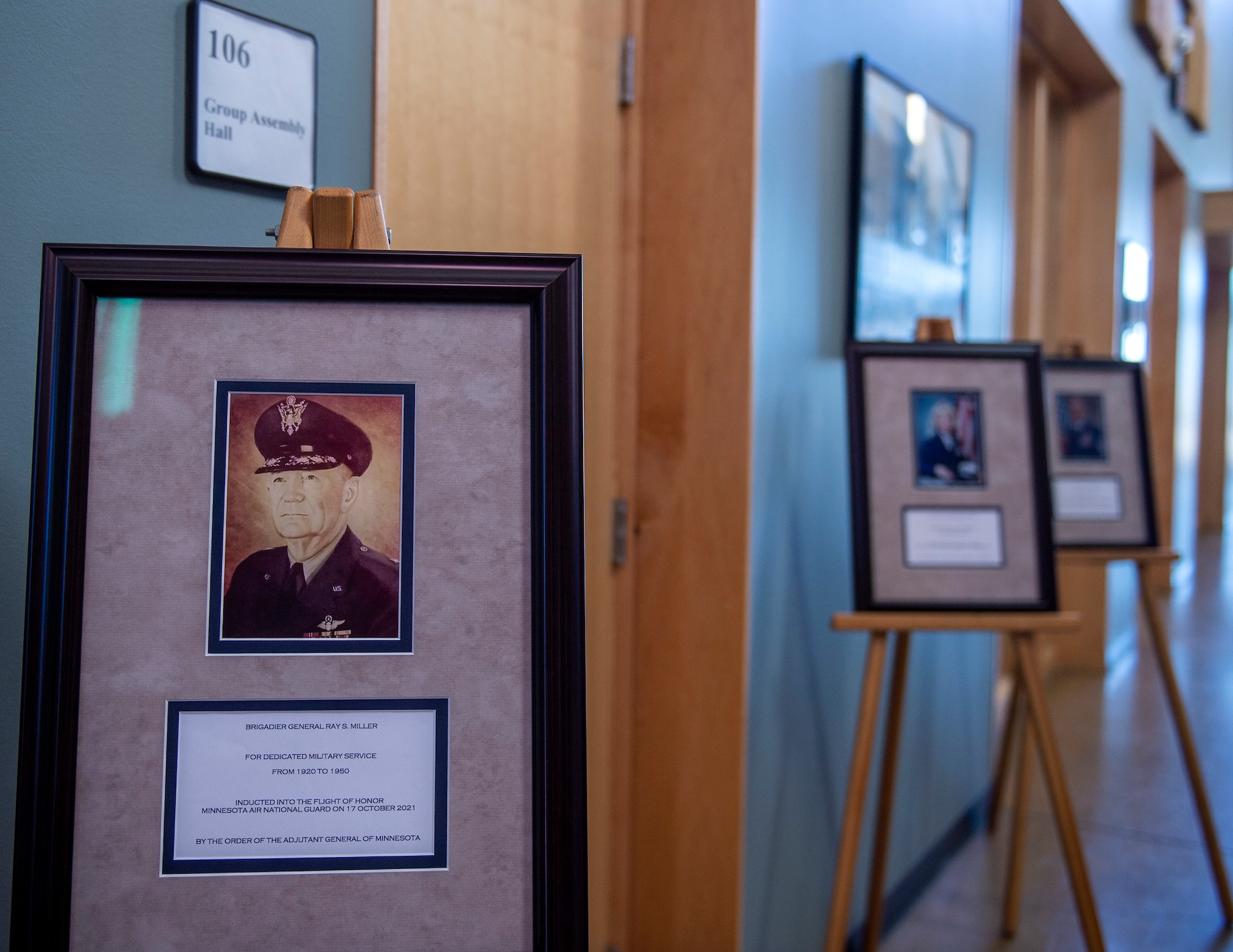Picture frames of the inductee for the 2021 Flight of Honor ceremony is on display in St. Paul, Minn., Oct. 17, 2021.