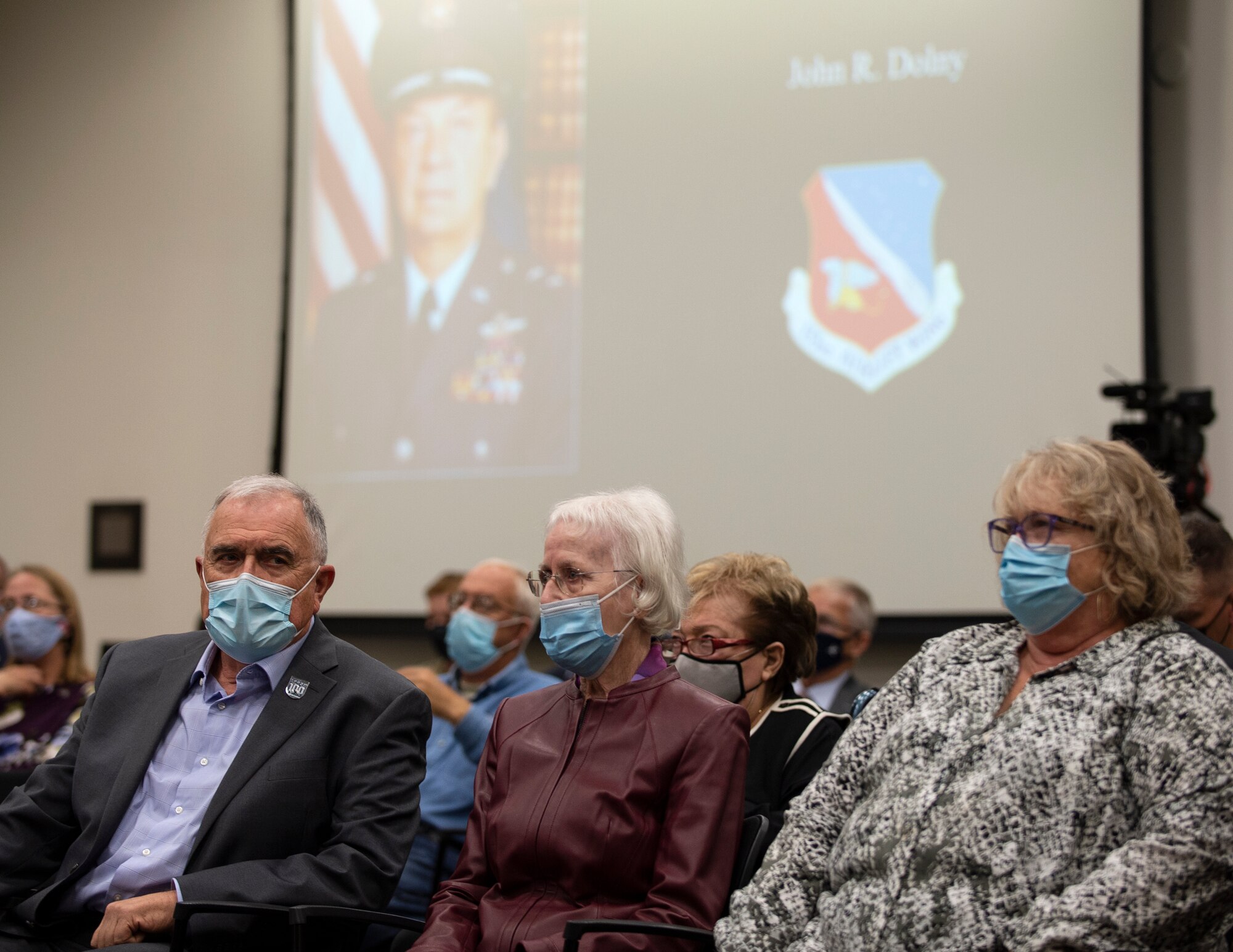 Family members for the 2021 Flight of Honor ceremony watch the ceremony in St. Paul, Minn., Oct. 17, 2021.