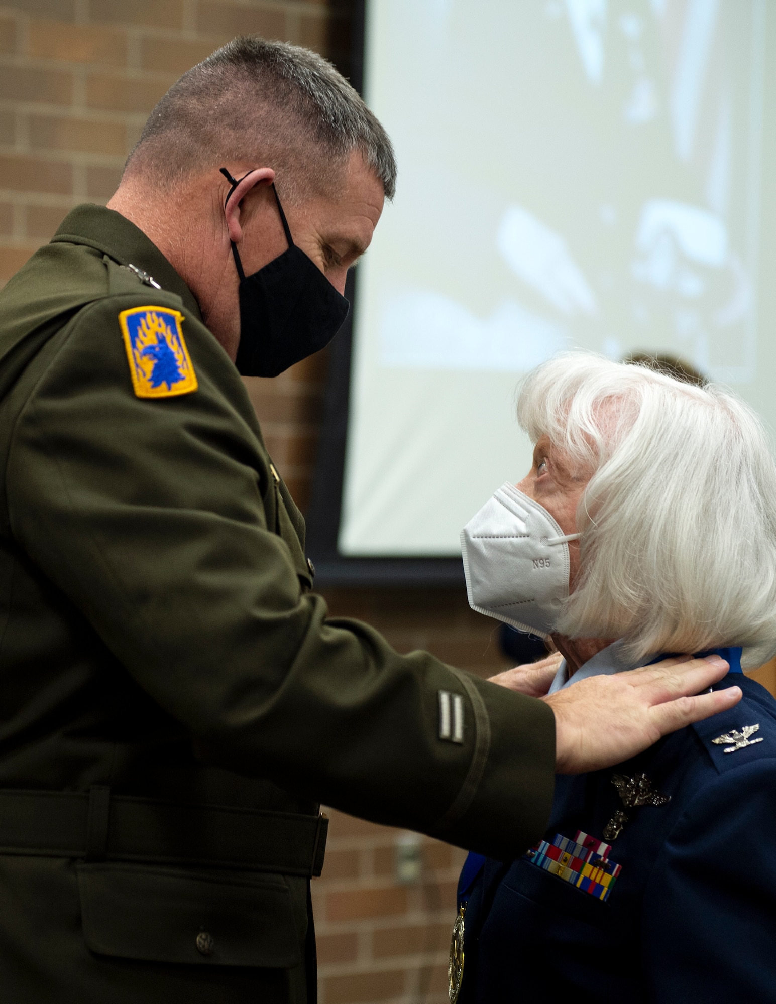 U.S. Air Force Col. (ret.) Julia "Julie" Eszlinger-Jensen, right, receives the Flight of Honor medal from U.S. Army Maj. Gen. Shawn Manke, The Adjutant General, Minnesota National Guard in St. Paul, Minn., Oct. 17, 2021.