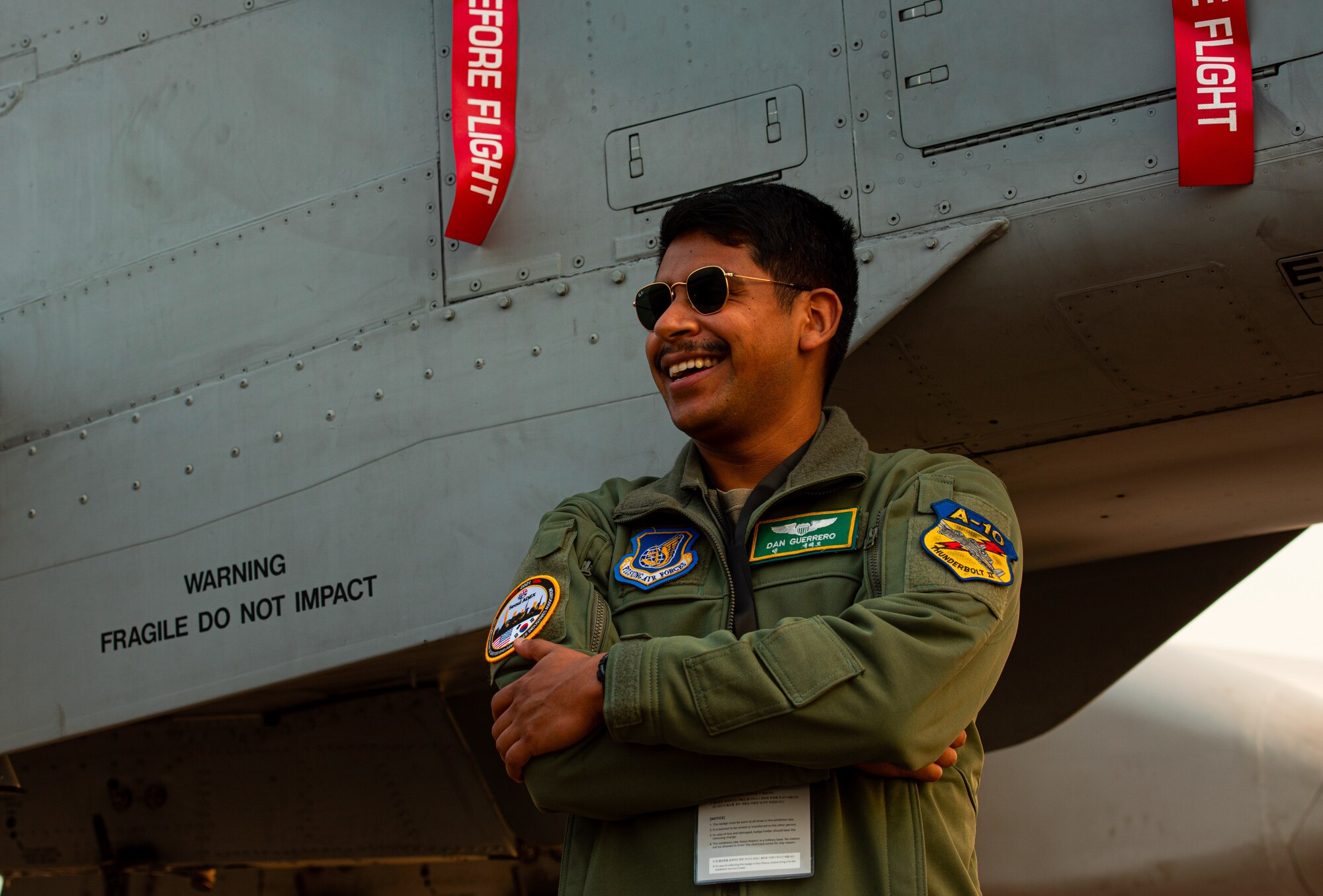 1st Lt. Daniel Guerrero, 25th Fighter Wing Squadron A-10 Thunderbolt II pilot, stands alongside the A-10 static display at the Seoul International Aerospace and Defense Exhibition, also known as Seoul ADEX 21, Oct. 21, 2021.