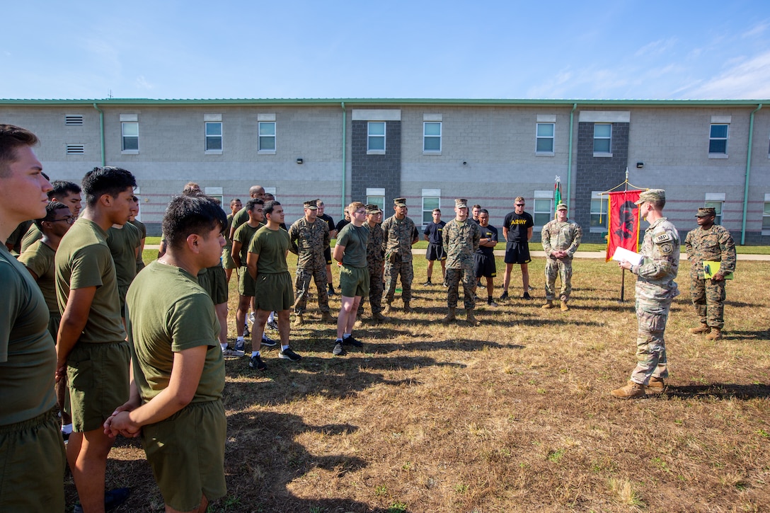 U.S. Army Capt. Joshua Love, company commander for 561st Military Police Company, 716th Military Police Battalion, 16th Military Police Brigade, 101st Airborne Division, reads a certificate to the Marines of Marine Wing Support Squadron 273 to recognize them for their help and cooperation with the 561st Military Police Co. on Fort Pickett, Virginia, Oct. 22, 2021.