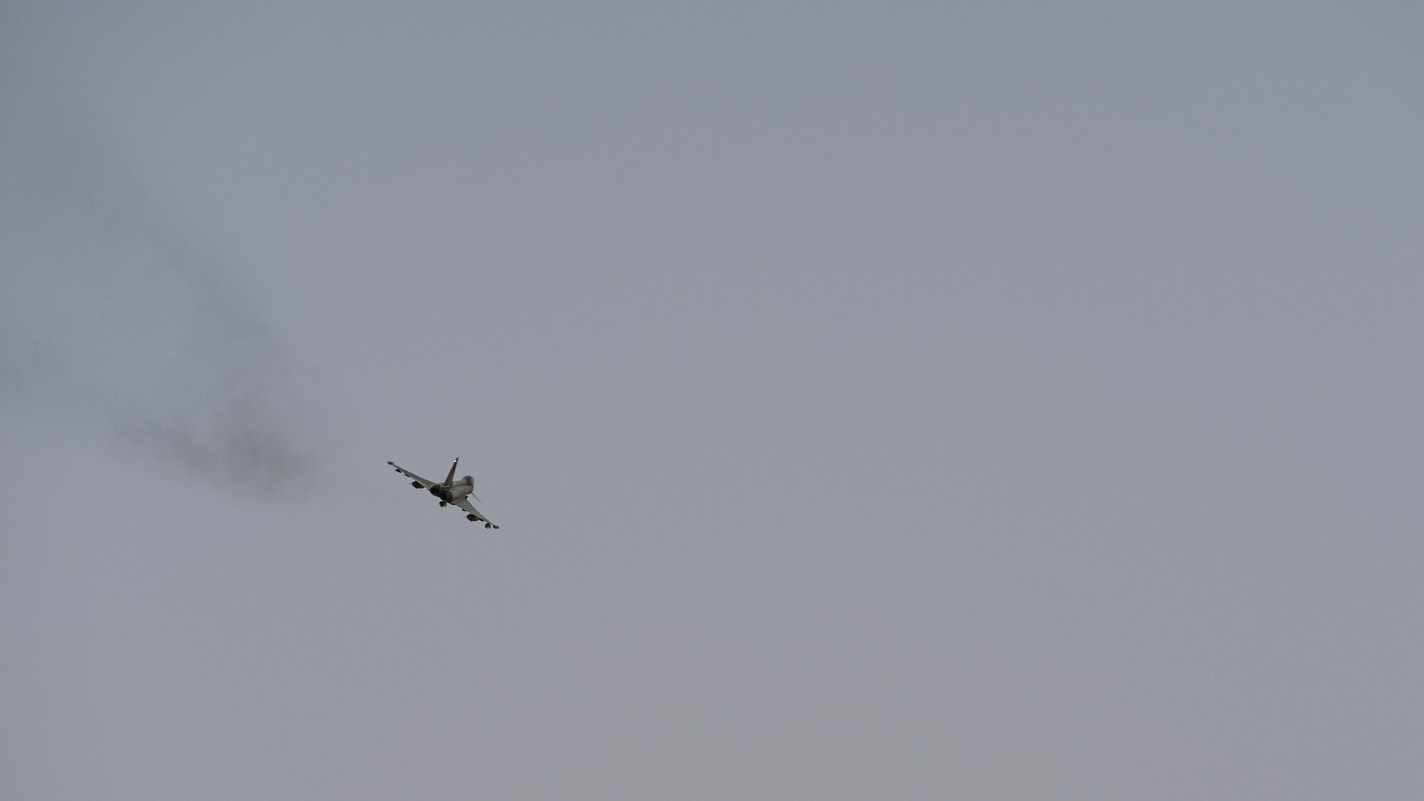 Italian air force (Aeronautica Militare) Eurofighter Typhoon flies above Udairi Range, Kuwait, Oct. 21, 2021. USAF JTACs deployed to the 82nd EASOS, along with the U.S. Army 1st Battalion 194th Armor Regiment joint fires observers in-training, and the ITAF Task Group Typhoon practiced close air support, fostered enduring partnerships and advanced its decisive combat dominance during a live-fire training exercise. (U.S. Air Force photo by Staff Sgt. Ryan Brooks)