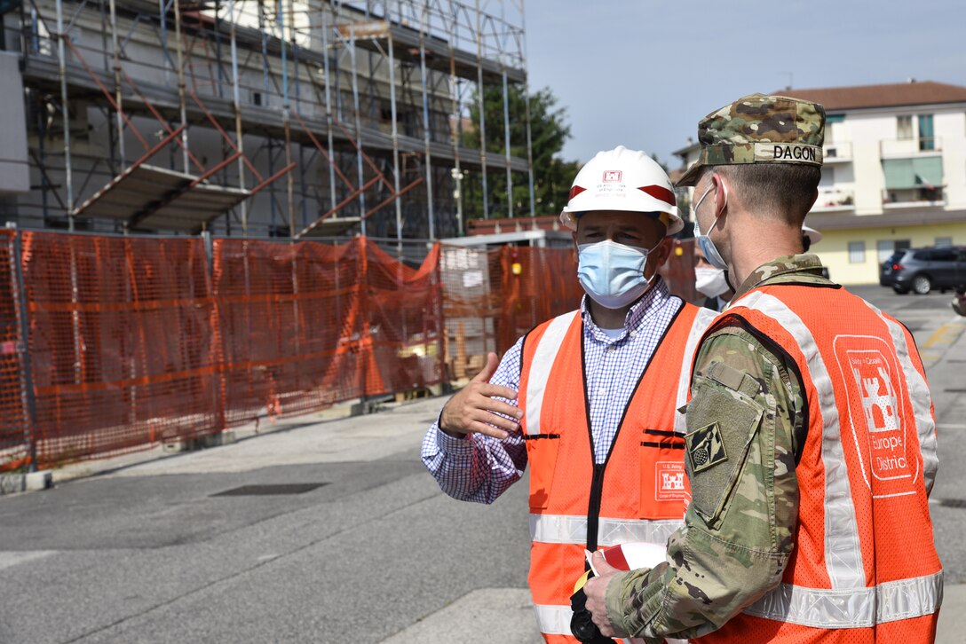 U.S. Army Corps of Engineers, Europe District Southern Europe Area Engineer Bryce Jones discusses nearby ongoing construction at Caserma Ederle, part of U.S. Army Garrison Italy in the Vicenza area, during a tour of the installation with Europe District Commander Col. Pat Dagon June 9, 2021. Jones was recognized as the U.S. Army Corps of Engineers Administrative Contracting Officer of the Year during a virtual ceremony October 25, 2021 for his work in support of the U.S. Army Corps of Engineers missions in Italy as well as several other Southern European countries. (U.S. Army photo by Chris Augsburger) (Chris Augsburger)