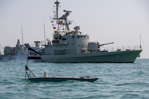 A MANTAS T-12 unmanned surface vessel (USV), front, operates alongside Royal Bahrain Naval Force fast-attack craft RBNS Abdul Rahman Al-fadel (P 22) during exercise New Horizon in the Arabian Gulf, Oct. 26. Exercise New Horizon was U.S. Naval Forces Central Command Task Force 59’s first at-sea evolution since its establishment Sept. 9.