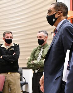 IMAGE: Naval Surface Warfare Center Dahlgren Division (NSWCDD) Commanding Officer Capt. Stephen ‘Casey’ Plew, NSWCDD Acting Technical Director Darren Barnes, and NSWCDD guest from the University of the District of Columbia Dr. Victor McCrary (pictured) listen to directed energy scientist Carl Carney during a demonstration. Former NSWCDD employee and current deputy VP at Raytheon Missiles and Defense Dr. Jim Moreland visited NSWCDD, Oct. 22.