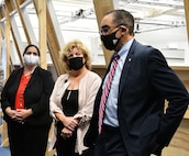 IMAGE: Dr. Liz Haro, Anita Kirkland, and Dr. Victor McCrary discuss human systems integration during a visit to the Naval Surface Warfare Center Dahlgren Division lab, Oct. 22.