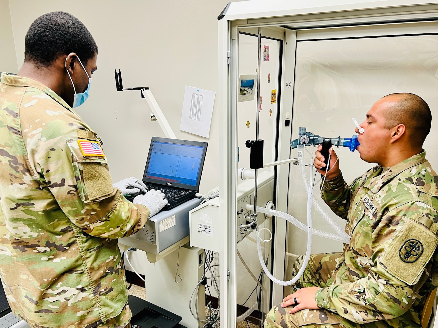 Sgt. Elvin E. Vann III, respiratory specialist, Bayne-Jones Army Community administers the pulmonary function test to Cpl. Giovani Gonzalez to measure his lung function and capacity at the Joint Readiness Training Center and Fort Polk, La., on Oct. 6.