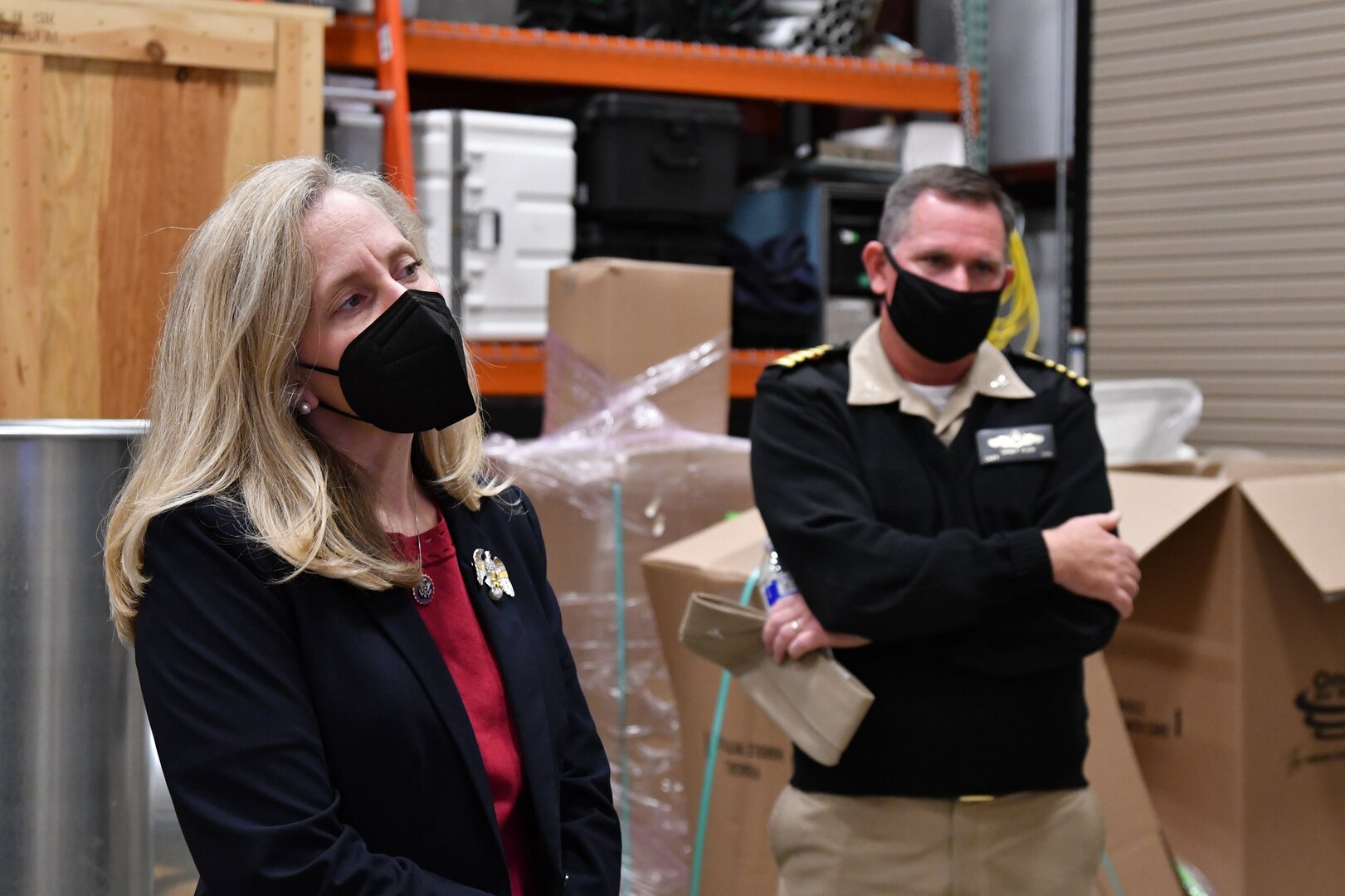 IMAGE: DAHLGREN, Va. - Rep. Abigail Spanberger and Capt. Stephen “Casey” Plew, commanding officer of Naval Surface Warfare Center Dahlgren Division (NSWCDD), listen to a brief in the laser lab aboard NSWCDD. During her visit, Spanberger received a Digital Proving Grounds Overview and participated in tours of the Digital Warfare Innovation Center and the laser lab.