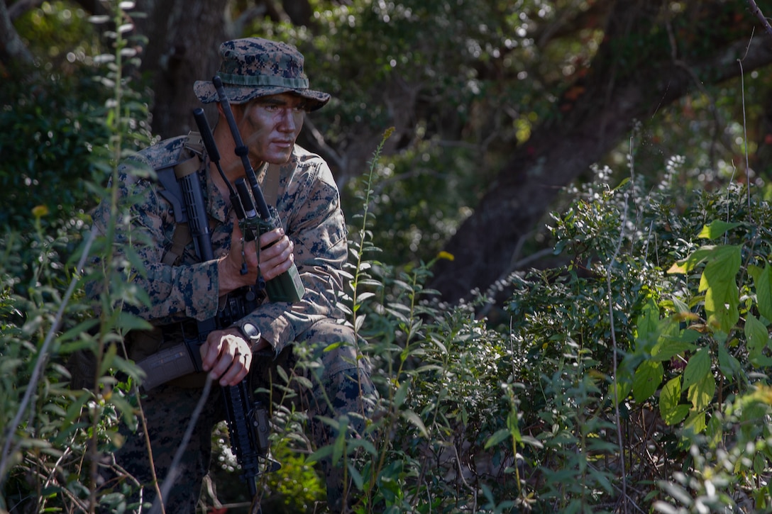 U.S. Marine Corps 1st Lt. William P. Hughes, an executive officer with 1st Battalion, 2nd Marine Regiment, 2nd Marine Division, conducts a radio check at Bogue Airfield, N.C., Oct. 23, 2021. The purpose of this training is to provide electronic warfare services utilizing the EMAV to support a unit commander as part of Strip Map, a specialized evaluation used to determine the efficacy of experimental ground formations.