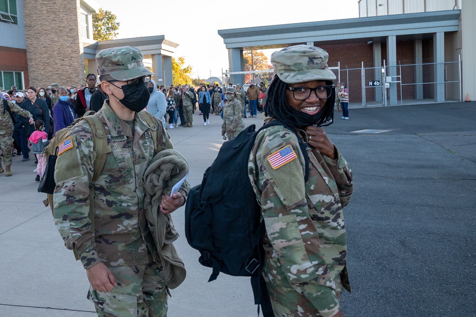 Connecticut National Guard Sgt. Kelle Kennerly walks to a bus outside the Army Aviation Support Facility in Windsor Locks, Conn., Oct. 24, 2021. Her unit, the 142nd Medical Company, was mobilizing to support Operation Atlantic Resolve and heading to Texas before deploying to Poland.