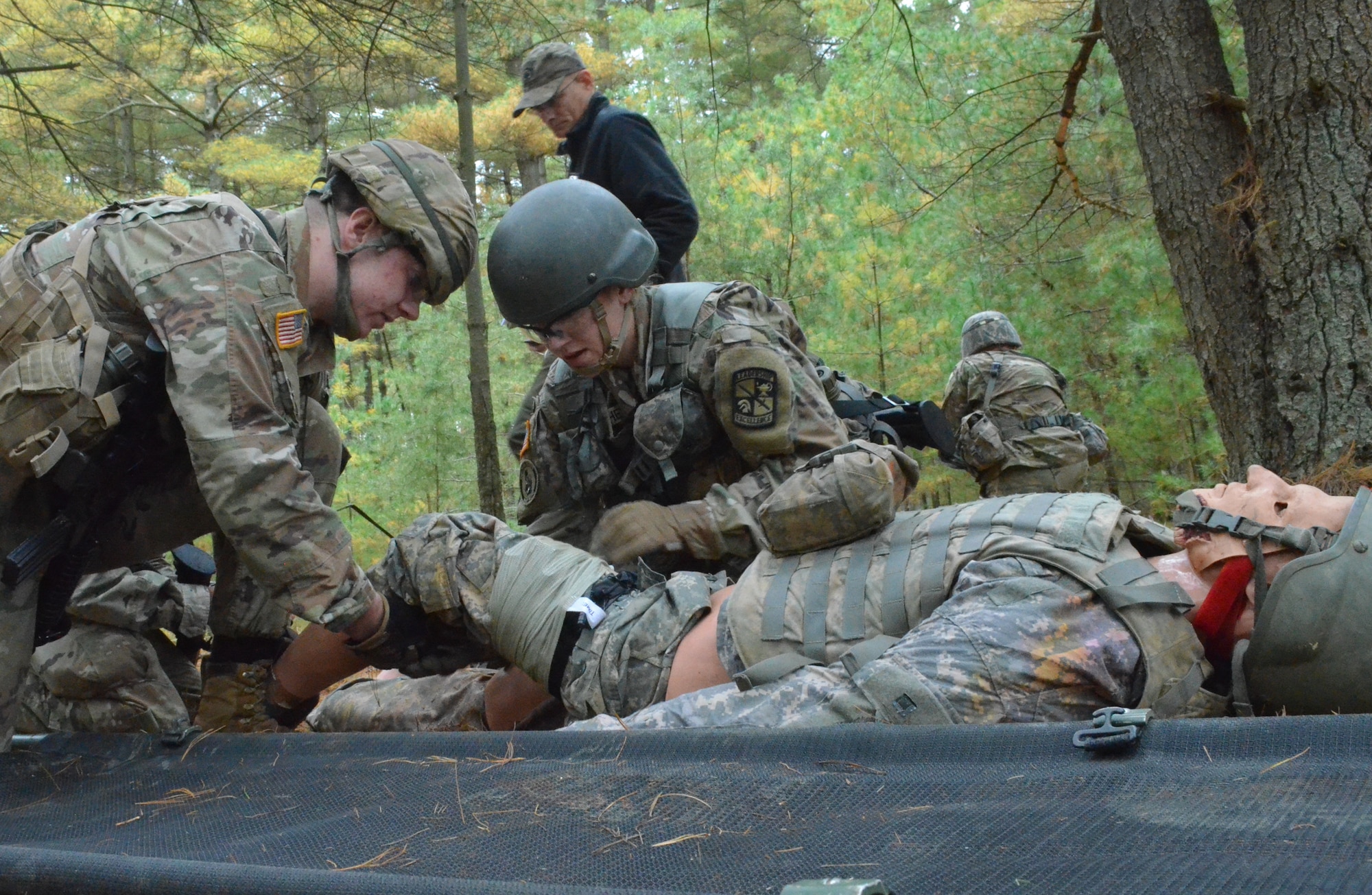 Cadet Mckayla Fletcher, Edenborough University, provides medical care for a simulated casualty at the Tactical Combat Casualty Care portion of the 2nd Brigade Ranger Challenge Oct. 23, 2021 at Joint Base McGuire-Dix-Lakehurst. The winning team will represent the brigade at the Sandhurst Military Skills competition at West Point in 2022.
