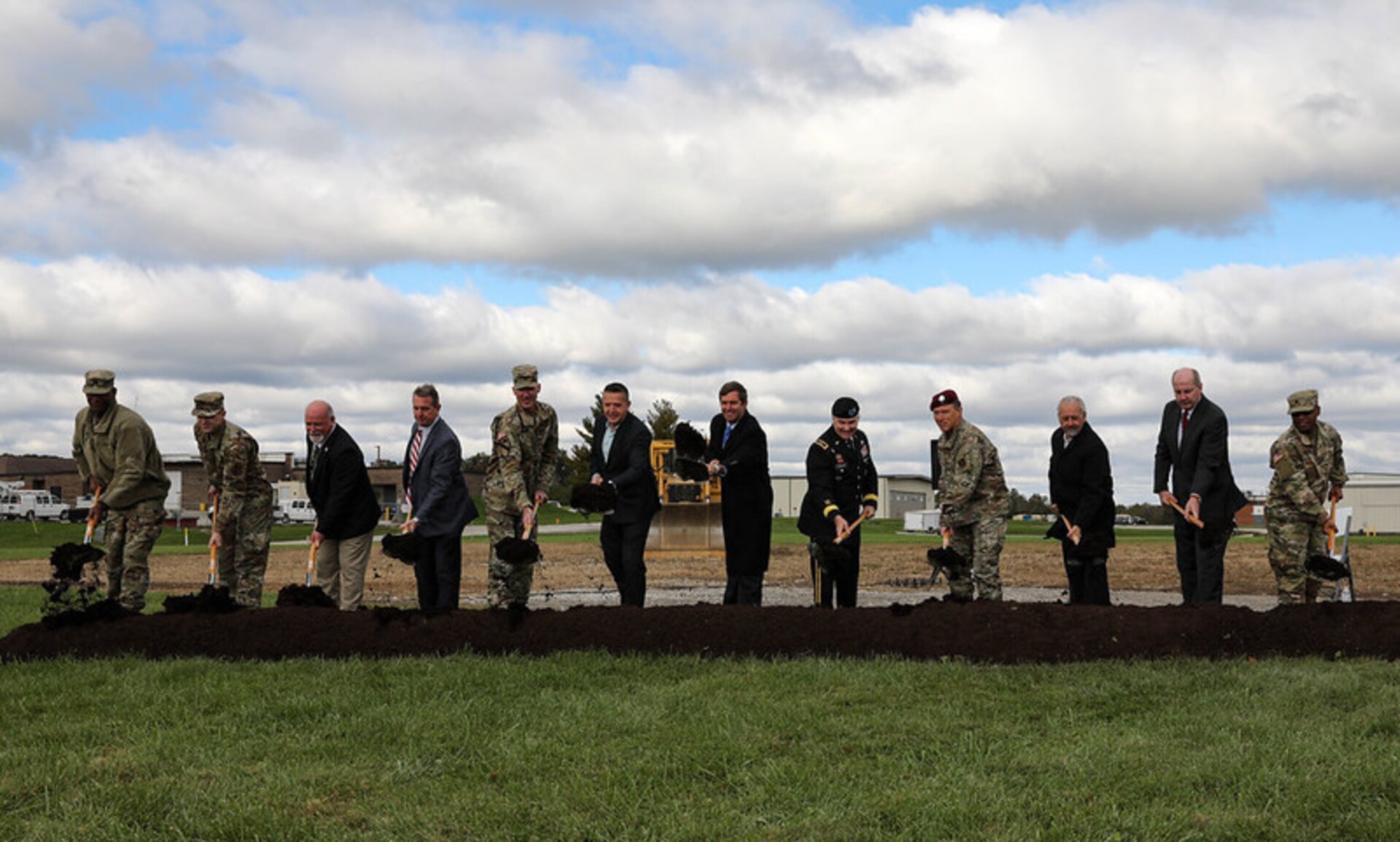 Kentucky Guardsmen and state leadership were on hand as ground was broken for the new Joint Force Headquarters building on Boone National Guard Center Oct. 26. 



Identified from left to right: Capt. Michael Hart, commander Joint Force Headquarters, Kentucky; Senior Airman Branden Strode, 123rd Airlift Wing, Kentucky Air Guard; Mr. Joe Sanderson, Director, Dept. of Military Affairs Facilities Division; Mr. Marty Meisberger, President, Monarch Construction Company, Brig. Gen. Brian Wertzler, Executive Director, Dept. of Military Affairs Office of Management and Administration; Brig. Gen. Steve King, Construction and Facilities Management Office, Kentucky Army National Guard; Gov. Andy Beshear; Maj. Gen. Haldane B. Lamberton, TAG-KY; Brig. Gen. Jeffery Wilkinson, Assistant Adjutant General-Air; Mr. Michael Jacobs, President, Omni Architects; Commisioner Sam Ruth, Dept. of Facilities Support Svcs, Finance Cabinet, Army Sgt. Christopher Martin, JFHQ.

The building has been twenty years in the making will be the first structure in the history of the Kentucky National Guard built solely for command and control of the KYNG.



 (U.S. Army National Guard photo by Jesse Elbouab)