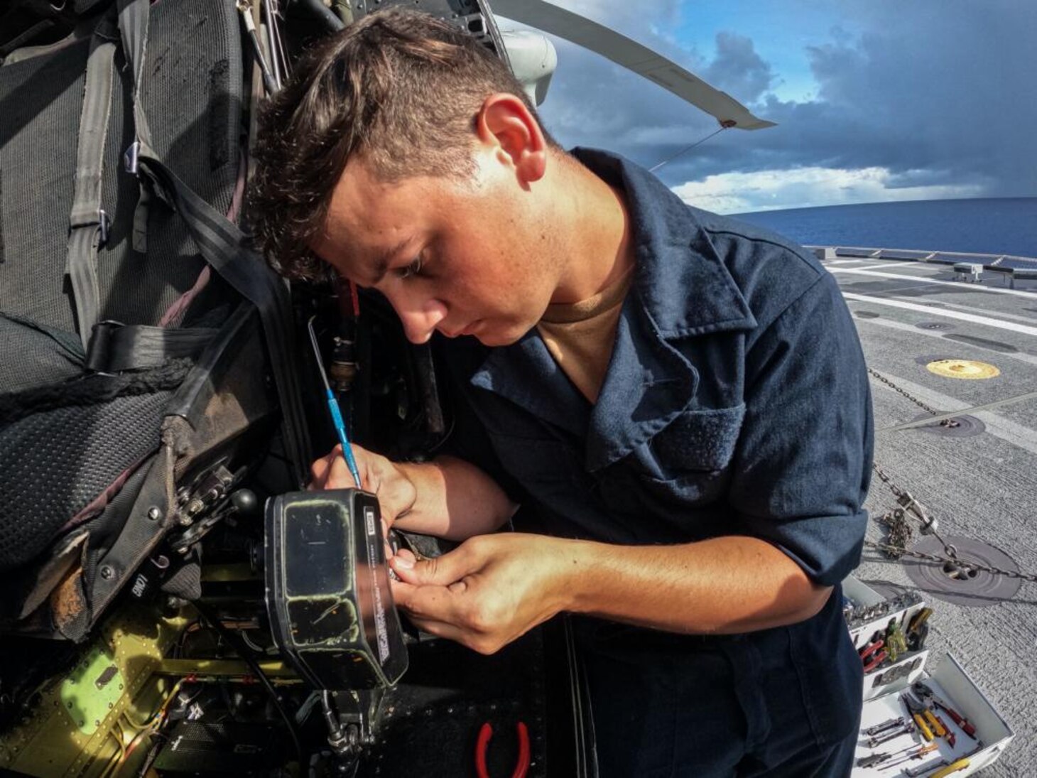 HSC 23 Sailor Performs Maintenance