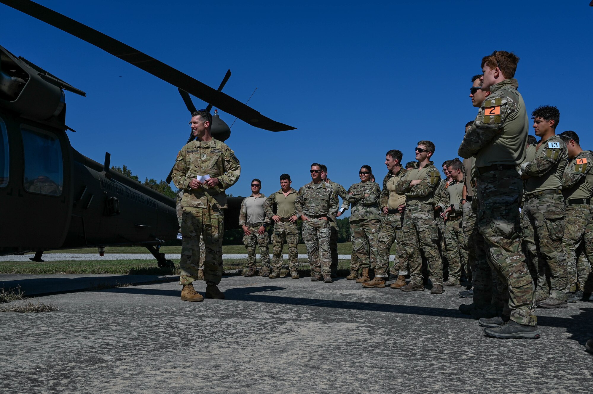 people standing near a helicopter