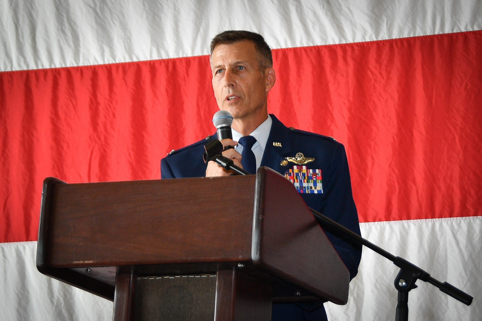 (Former) 301st Fighter Wing Director of Staff Col. Kevin "Fuzzy" Zeller addresses family and friends during a retirement ceremony at Naval Air Station Joint Reserve Base Fort Worth, Texas, Oct. 23, 2021. He said he'll definitely miss flying the jets but the relationships and camaraderie is what he'll missed most. For 17 of his past 20 years serving in the Air force Reserve, Zeller has been assigned to the wing in a variety of leadership positions. (U.S. Air Force photo by Jeremy Roman)