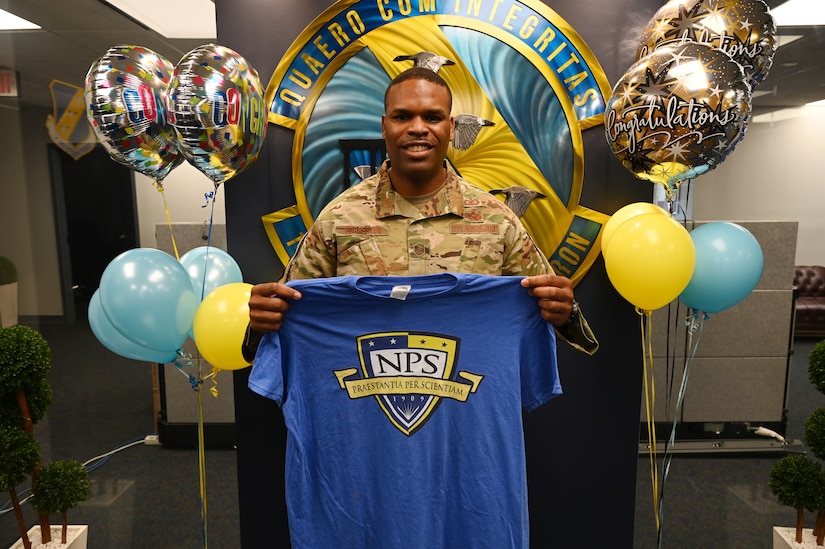 U.S. Air Force Master Sgt. Kade Forrester (Center), 11th Contracting Squadron Infrastructure Flight section chief at Joint Base Anacostia-Bolling, Washington, D.C., stands for a photo with JBAB and his CONS leadership team during a recognition ceremony on Oct. 21, 2021. Forrester became one of the first two enlisted Airmen to ever be selected to attend Naval Postgraduate School. Forrester will attend the 18-month Acquisitions and Contract Management program in Monterey, California. (U.S. Air Force photo by Staff Sgt. Kayla White)