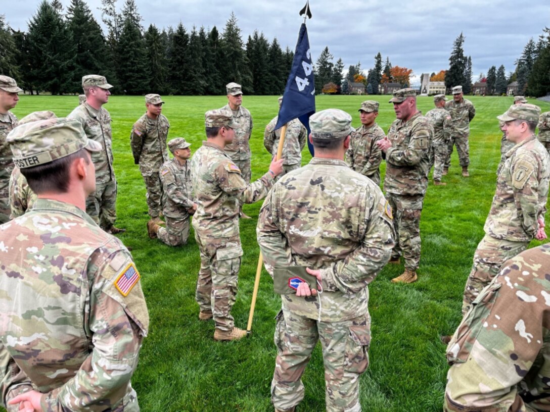 Lt. Col. Alan Perkins, commander of the 100th Battalion 442nd Infantry Regiment names 1st Lt. Christopher Arakawa the new commander of Charlie company in an unofficial ceremony at Joint Base Lewis-McChord immediately following its uncasing ceremony