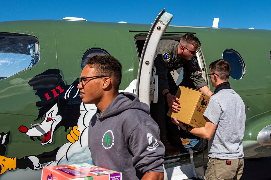 Members from the 86th Flying Training Squadron and the 49th Wing, unload supplies for Operation Allies Welcome at Holloman Air Force Base, New Mexico on Oct. 18 2021. Operation Allies Refuge is a United States military operation to airlift certain at-risk Afghan civilians, particularly interpreters, U.S. embassy employees, and other prospective Special Immigrant Visa applicants from Afghanistan. (U.S. Air Force photo by Senior Airman David Phaff)