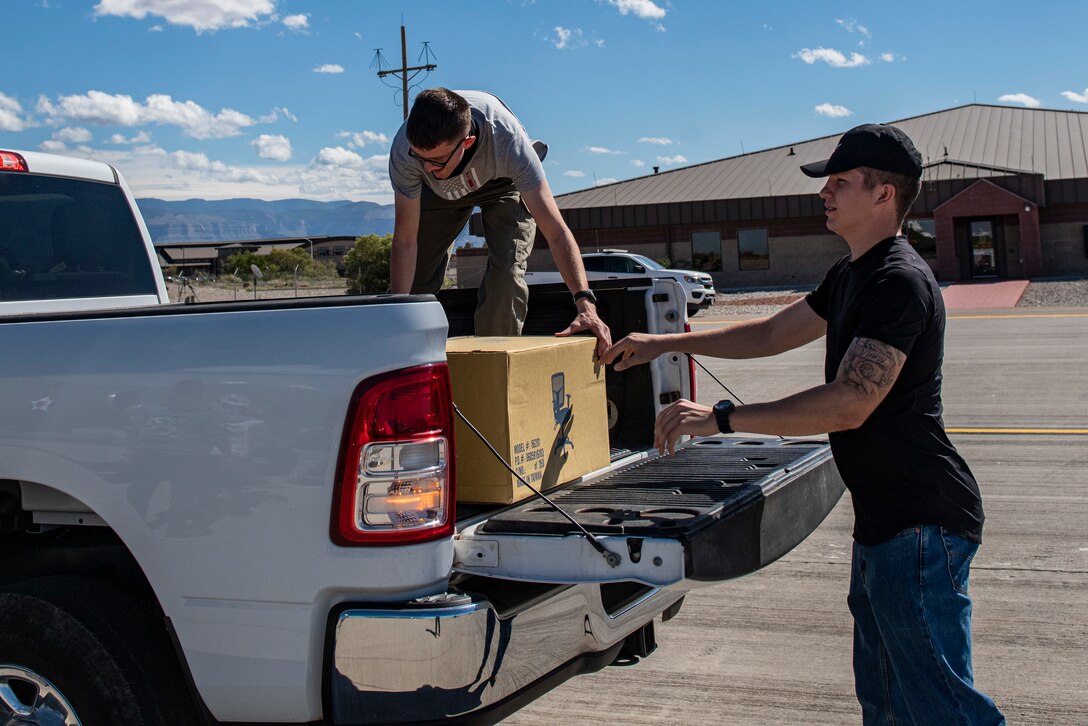 Members from the 49th Wing unload supplies for Operation Allies Welcome at Holloman Air Force Base, New Mexico on Oct. 18 2021. Operation Allies Refuge is a United States military operation to airlift certain at-risk Afghan civilians, particularly interpreters, U.S. embassy employees, and other prospective Special Immigrant Visa applicants from Afghanistan. (U.S. Air Force photo by Senior Airman David Phaff)