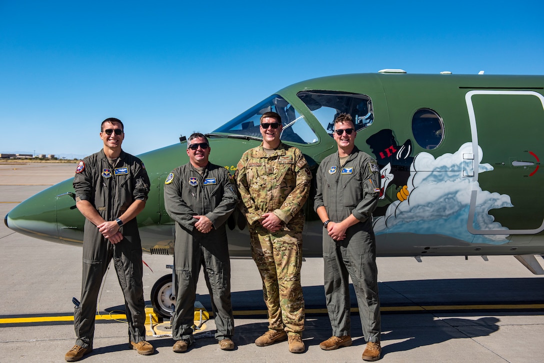 Members from the 86th Flying Training Squadron, pose in front of their heritage tail at Holloman Air Force Base, New Mexico on Oct. 18 2021. Operation Allies Refuge is a United States military operation to airlift certain at-risk Afghan civilians, particularly interpreters, U.S. embassy employees, and other prospective Special Immigrant Visa applicants from Afghanistan. (U.S. Air Force photo by Senior Airman David Phaff)