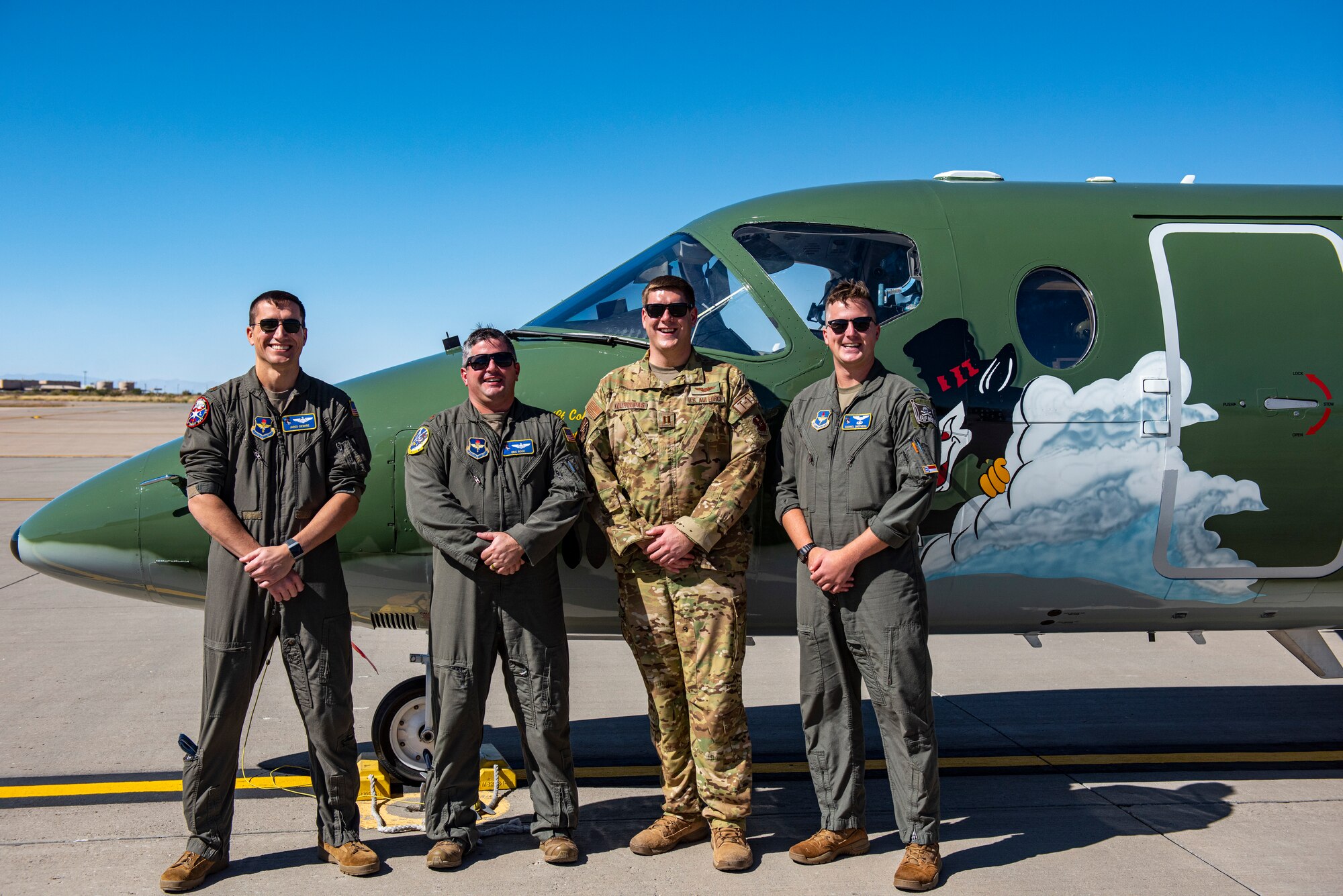Members from the 86th Flying Training Squadron, pose in front of their heritage tail at Holloman Air Force Base, New Mexico on Oct. 18 2021. Operation Allies Refuge is a United States military operation to airlift certain at-risk Afghan civilians, particularly interpreters, U.S. embassy employees, and other prospective Special Immigrant Visa applicants from Afghanistan. (U.S. Air Force photo by Senior Airman David Phaff)
