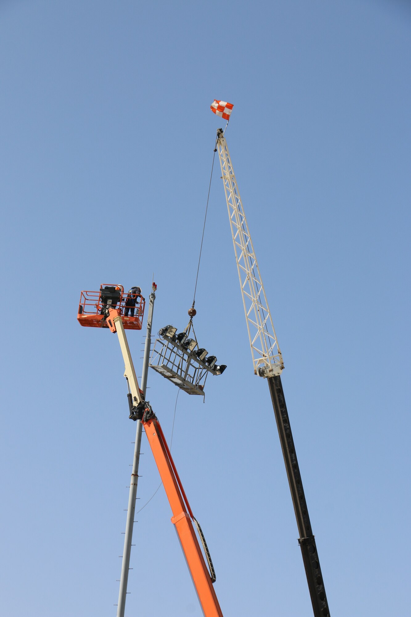 A photo of people replacing lights.