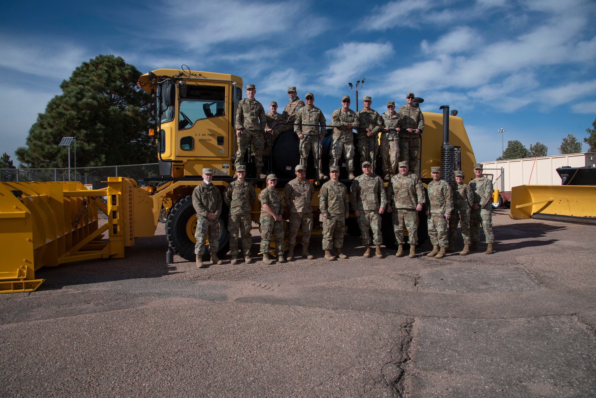 U.S. Air Force Col. David Wilson, Peterson-Schriever Garrison vice commander and the 21st Mission Support Group commander; and U.S. Air Force Staff Sgt. Lemuel Travis, 21st Civil Engineer Squadron pavements and heavy construction supervisor, go over the basics of operating a snow plow at Peterson Space Force Base, Colorado, Oct. 21, 2021.