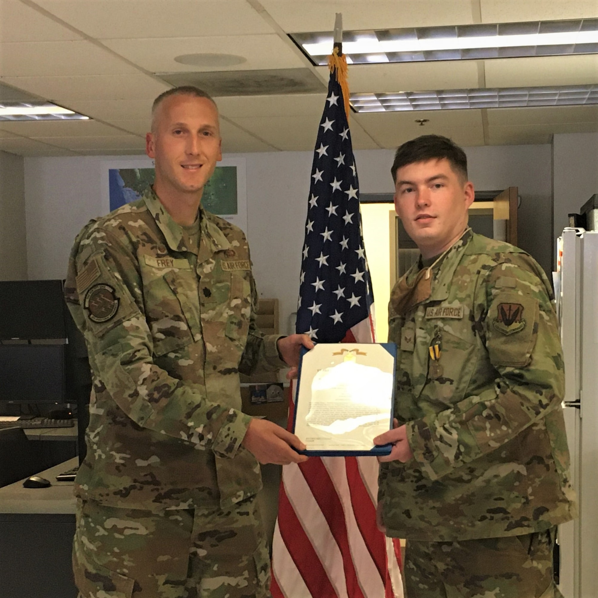 A photo of an Airman receiving a medal.