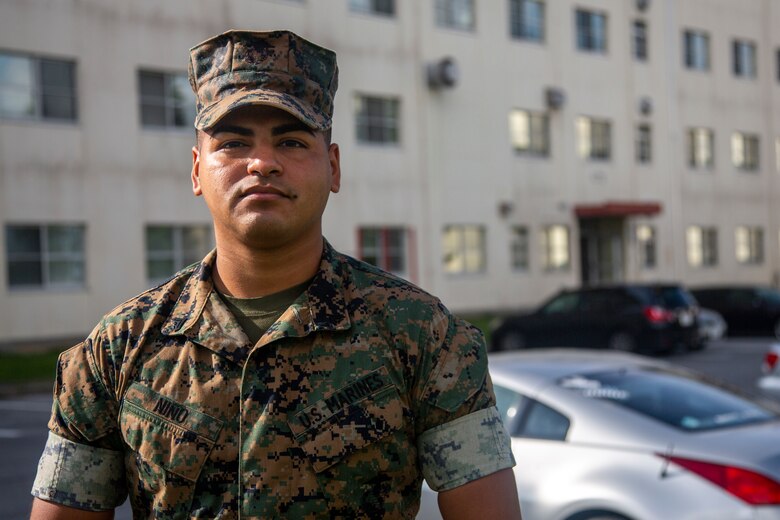 U.S. Marine Corps Cpl. Matthew Niño, a barracks manager with Headquarters and Support Battalion, Marine Corps Installations Pacific, poses for an environmental portrait at Company B barracks on Camp Foster, Okinawa, Japan, Oct. 14, 2021. As a barracks manager, Niño is responsible for the upkeep and maintenance of his barracks, and directly supports unit morale and cohesion through the constant improvements and renovations he oversees for the barracks. Niño is a native of McAllen, Texas. (U.S. Marine Corps photo by Lance Cpl. Ricardo Deseanogomez)