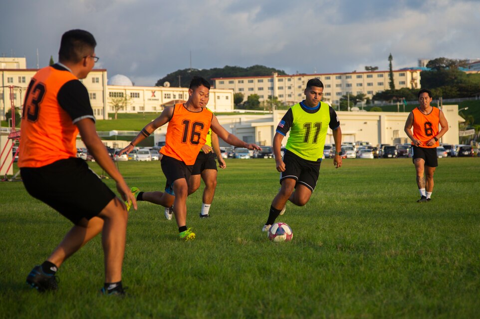 U.S. Marine Corps Cpl. Matthew Niño, a barracks manager with Headquarters and Support Battalion, Marine Corps Installations Pacific, participates in a soccer game on Camp Foster, Okinawa, Japan, Oct. 14, 2021. As a barracks manager, Niño is responsible for the upkeep and maintenance of his barracks, and directly supports unit morale and cohesion through the constant improvements and renovations he oversees for the barracks. Niño is a native of McAllen, Texas. (U.S. Marine Corps photo by Lance Cpl. Ricardo Deseanogomez)