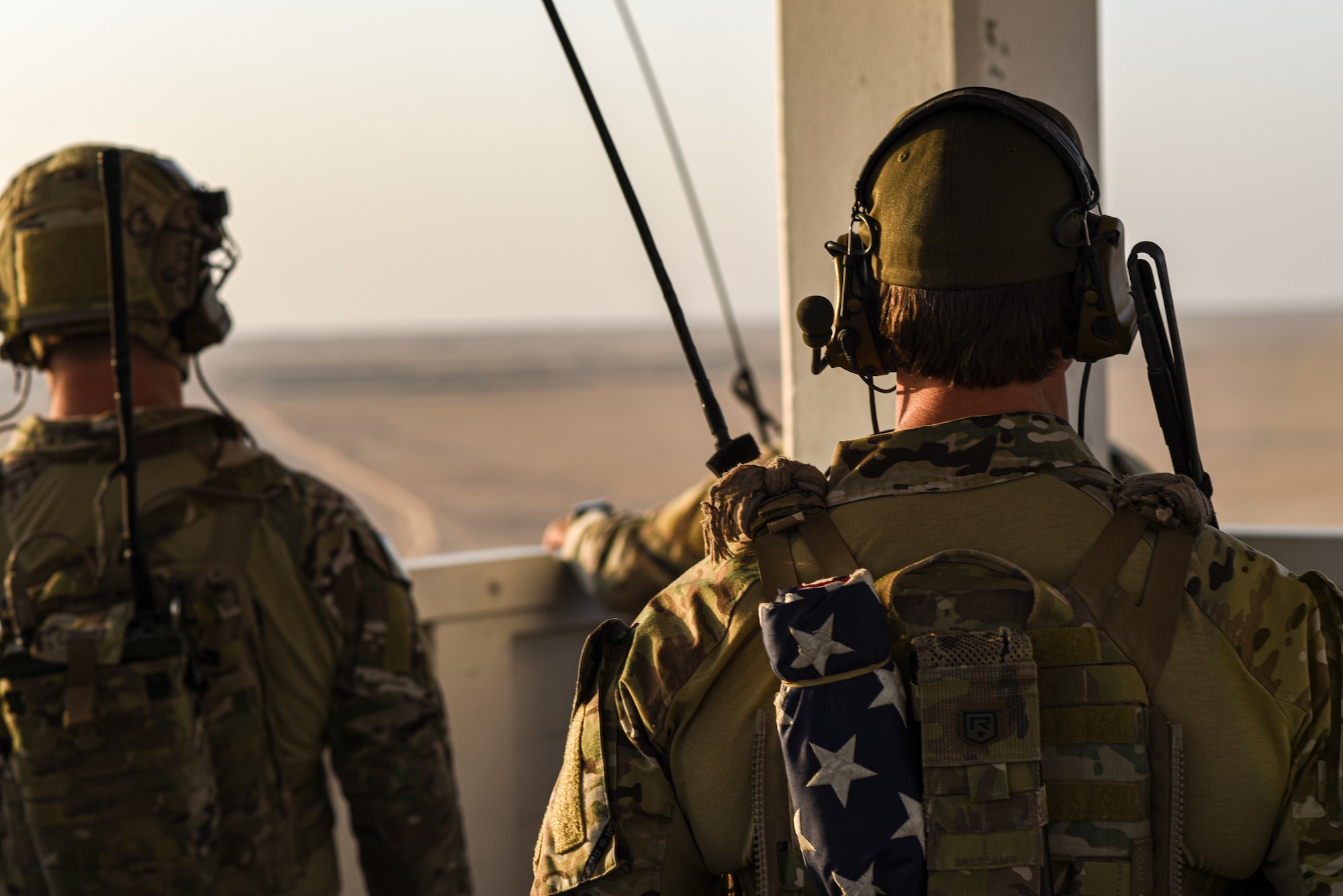 U.S. Air Force joint terminal attack controllers assigned to the 82nd Expeditionary Air Support Operations Squadron watch Eurofighter Typhoons in the sky over Udairi Range, Kuwait, Oct. 21, 2021. USAF JTACs deployed to the 82nd EASOS, along with the U.S. Army 1st Battalion 194th Armor Regiment joint fires observers in-training, and the Italian air force (Aeronautica Militare) Task Group Typhoon practiced close air support, fostered enduring partnerships and advanced its decisive combat dominance during a live-fire training exercise. (U.S. Air Force photo by Staff Sgt. Ryan Brooks)