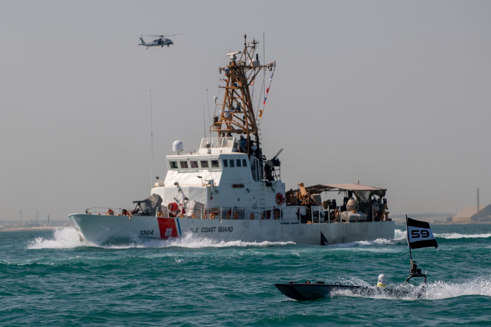 A MANTAS T-12 unmanned surface vessel (USV), front, operates alongside U.S. Coast Guard patrol boat USCGC Maui (WPB 1304) during exercise New Horizon in the Arabian Gulf, Oct. 26. Exercise New Horizon was U.S. Naval Forces Central Command Task Force 59’s first at-sea evolution since its establishment Sept. 9.